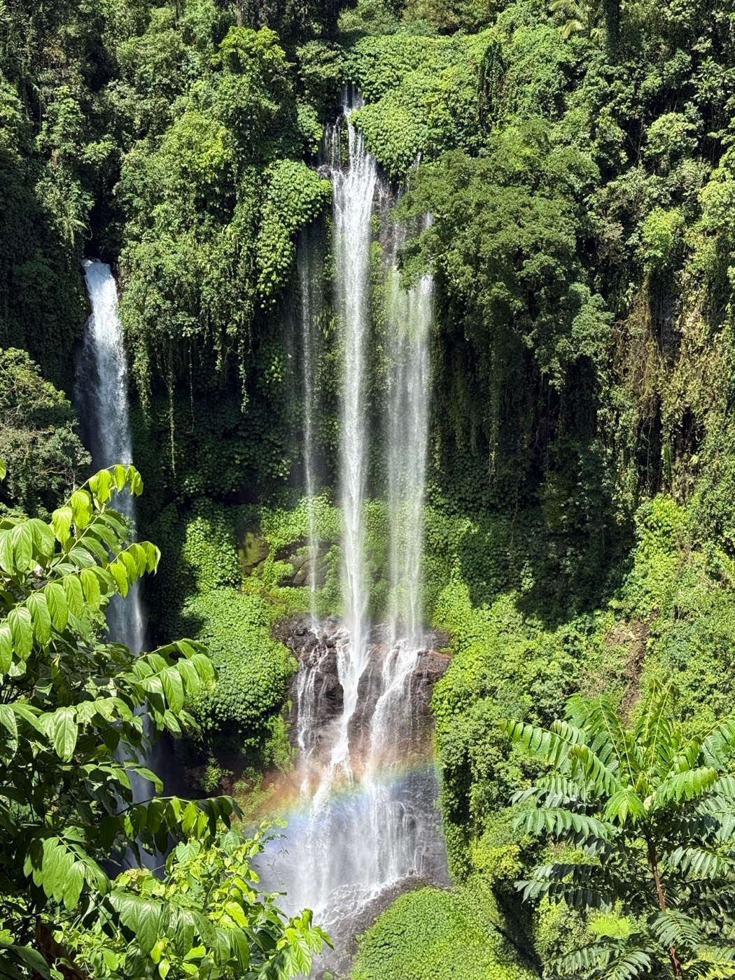 Sekumpul waterfall, north Bali. With a rainbow in the spray